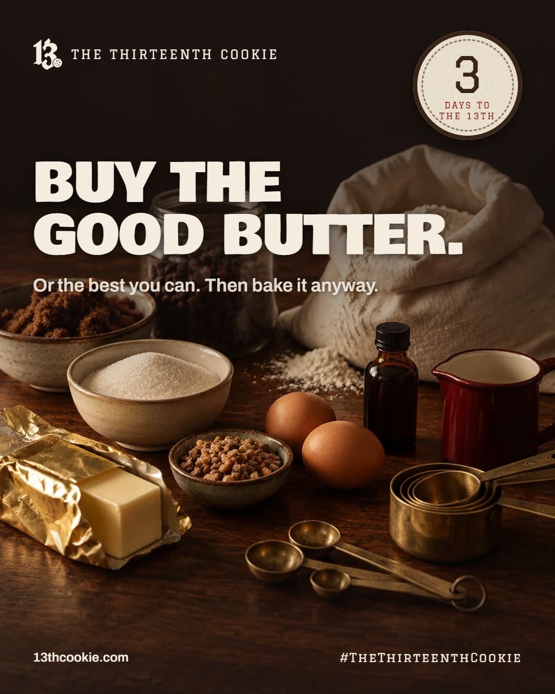 Baking ingredients on a dark wood counter: gold-wrapped butter, flour, brown sugar, chocolate chips, toffee bits and measuring cups.
